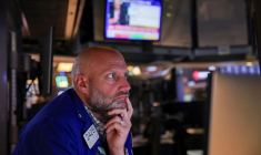 A trader works on the floor at the New York Stock Exchange (NYSE) in New York City